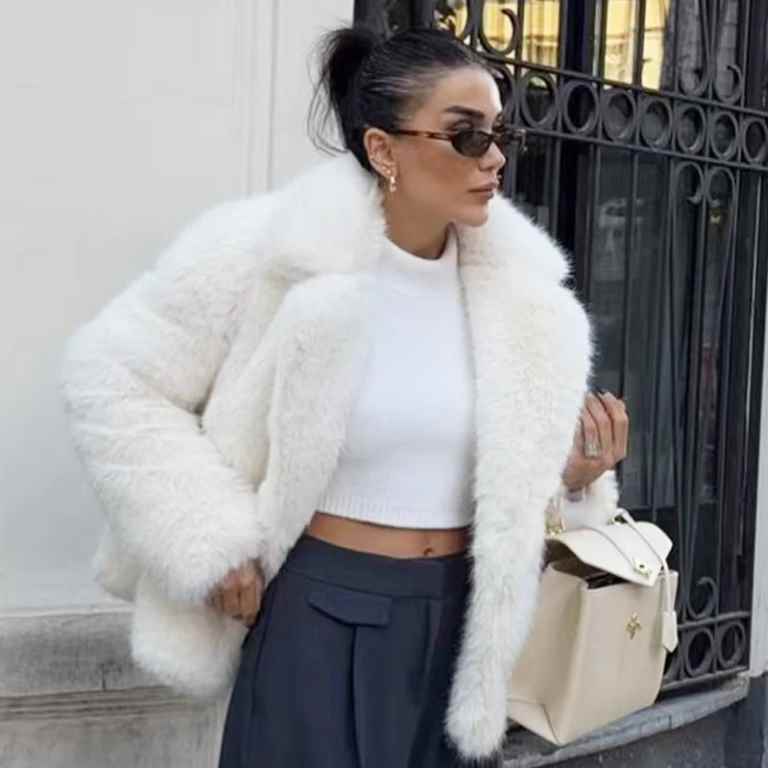 Stay warm and stylish this winter with a women’s white faux fur cropped jacket. Featuring a fluffy, plush design with long sleeves, it’s perfect for casual or elegant looks.