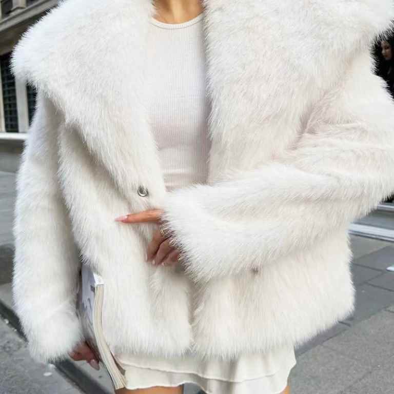 Stay warm and stylish this winter with a women’s white faux fur cropped jacket. Featuring a fluffy, plush design with long sleeves, it’s perfect for casual or elegant looks.