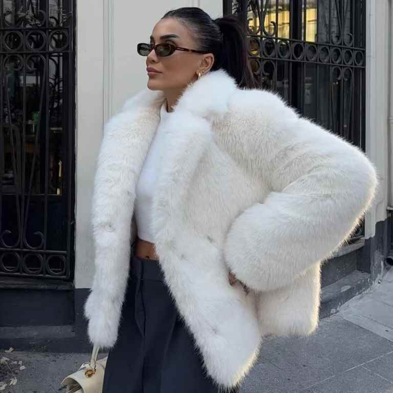 Stay warm and stylish this winter with a women’s white faux fur cropped jacket. Featuring a fluffy, plush design with long sleeves, it’s perfect for casual or elegant looks.